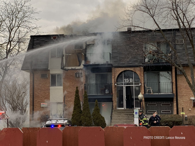 Deck gun at work at a fire scene at an apartment condo building on Dundee Quarter in Palatine (PHOTO CREDIT: Lance Neuses)