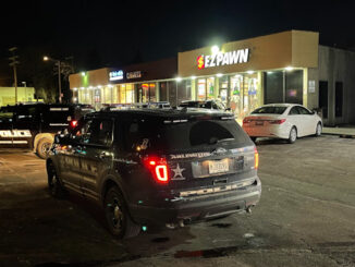 Arlington Heights Police Department begins an investigation of an armed robbery at a pawn shop, checking security cameras on Friday, January 22, 2021