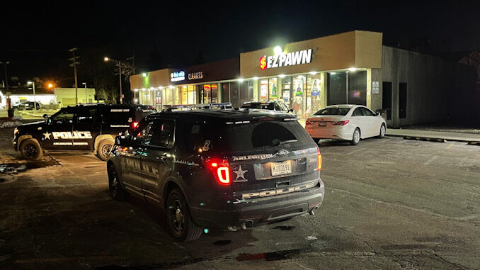 Arlington Heights Police Department begins an investigation of an armed robbery at a pawn shop, checking security cameras on Friday, January 22, 2021