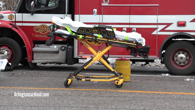 Ambulance on standby on Oakton Street in Des Plaines