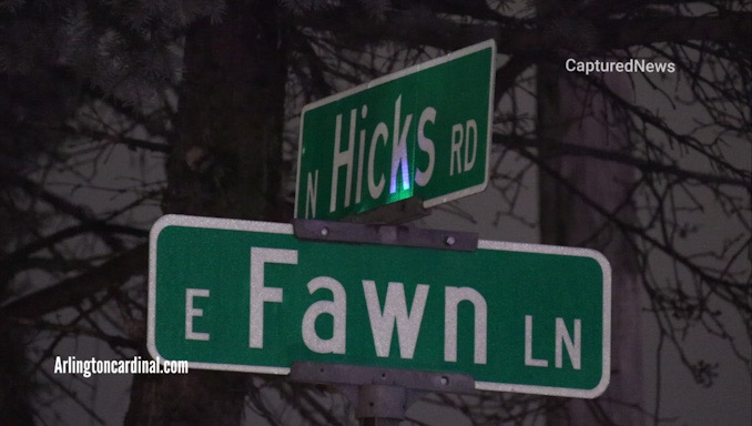 The intersection of Hicks Road and Fawn Lane at the entrance to the Deer Path Lake townhouse condominium subdivision in Palatine between Lake Cook Road and Rand Road (US-12)