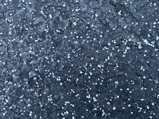 Graupel on black asphalt about 4:45 p.m. Monday, January 25, 2021 in Arlington Heights