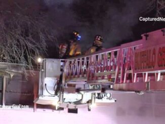 Buffalo Grove Tower Ladder at Side A at a house fire in Arlington Heights