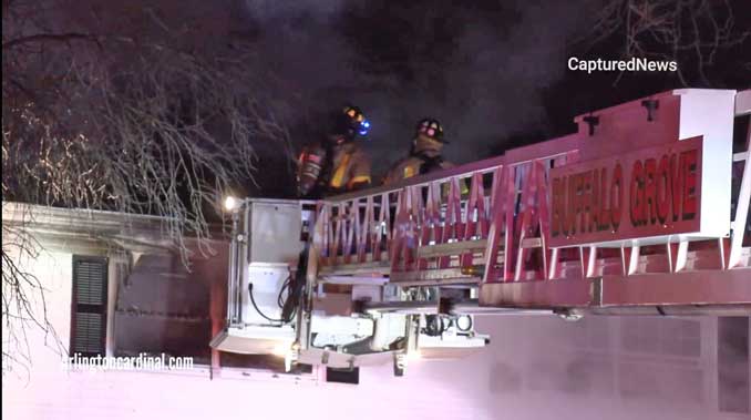 Buffalo Grove Tower Ladder at Side A at a house fire in Arlington Heights