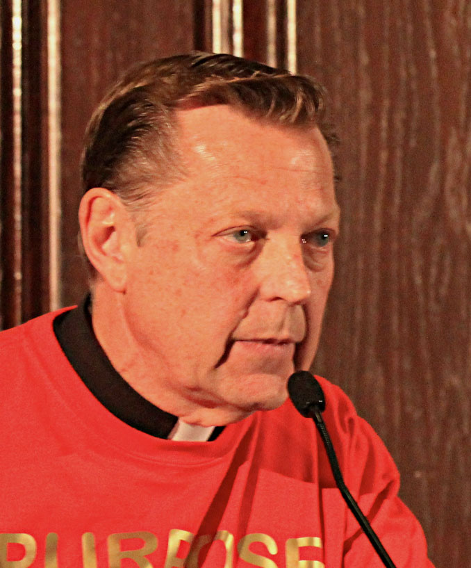 Father Michael Pfleger at 	City Club of Chicago event, "Chiraq Dr. Carl Bell, Hon. Will Burns, John Fountain, and Rev. Michael Pfleger" (SOURCE: Daniel X. O'Neil from USA, CC BY 2.0, via Wikimedia Commons)