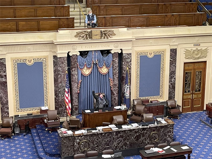 A single protester shown in the video feed at the House Chamber