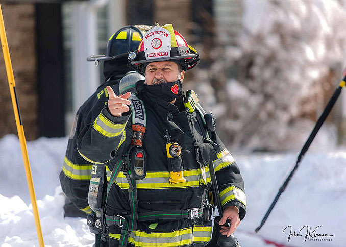 Fire lieutenant from Prospect Heights work at house fire on Patton Drive in Buffalo Grove (PHOTO CREDIT: J Kleeman)