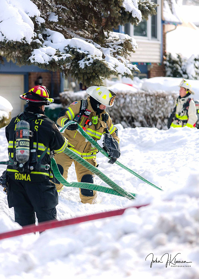 Hose line on fireground on Patton Drive in Buffalo Grove (PHOTO CREDIT: J Kleeman)