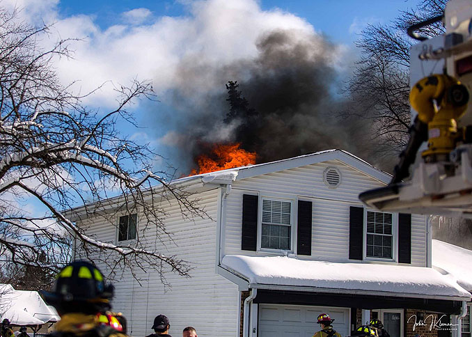 Fire and smoke showing through the roof on Patton Drive in Buffalo Grove (PHOTO CREDIT: J Kleeman)