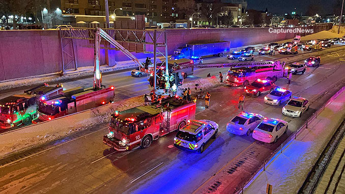 Squad 5 with snorkel up and Truck 18 with main aerial up during difficult extrication on the Dan Ryan Expressway on Tuesday, February 9, 2021 (PHOTO: Captured News)