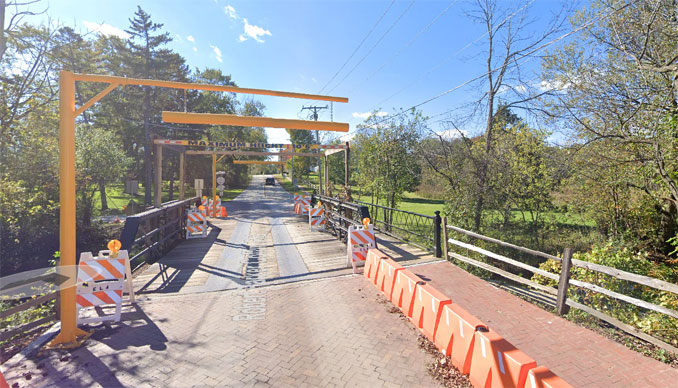 Long Grove Covered Bridge shortly after a box truck crash destroyed the old cover (Image capture October 2018 ©2018 Google )