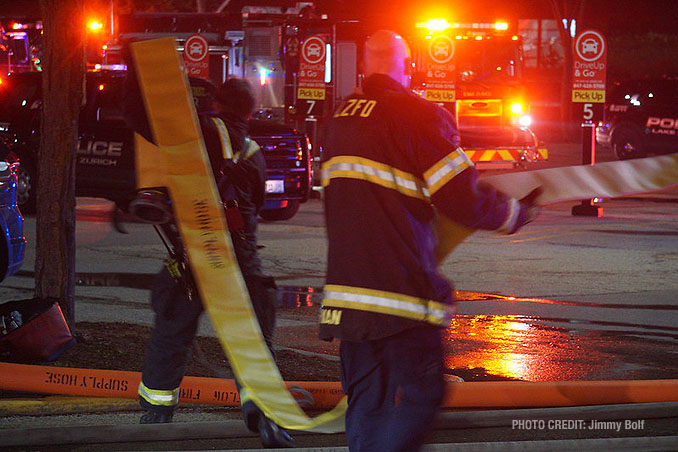 Setting up water supply at an extra alarm fire at Burger King on Rand Road in Lake Zurich (PHOTO CREDIT: Jimmy Bolf)