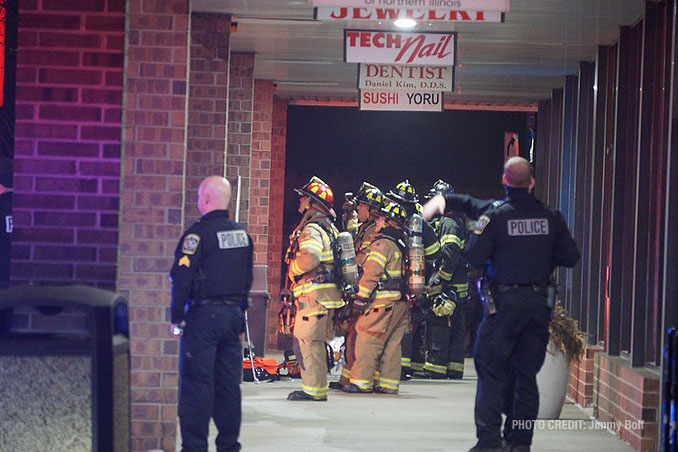 Firefighters waiting for assignments at extra alarm fire at Burger King on Rand Road in Lake Zurich (PHOTO CREDIT: Jimmy Bolf)