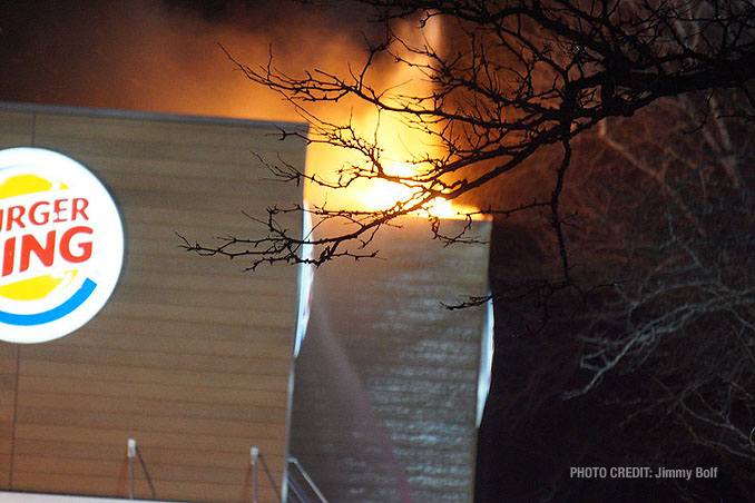 Fire breaks through the roof at extra alarm fire at Burger King on Rand Road in Lake Zurich (PHOTO CREDIT: Jimmy Bolf)