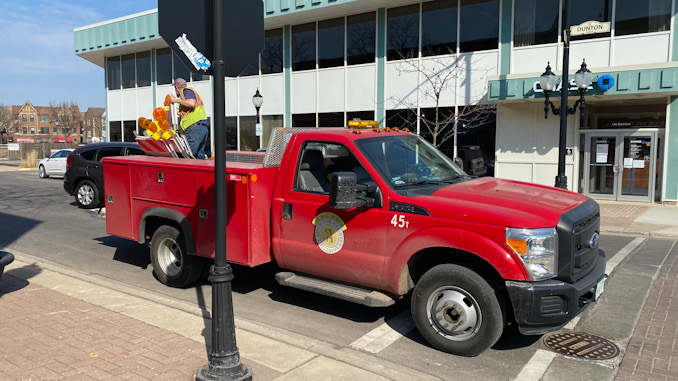 Arlington Heights Public Works set up barricades to prepare for street closures for Arlington Alfresco at 4:00 a.m. Wednesday morning.