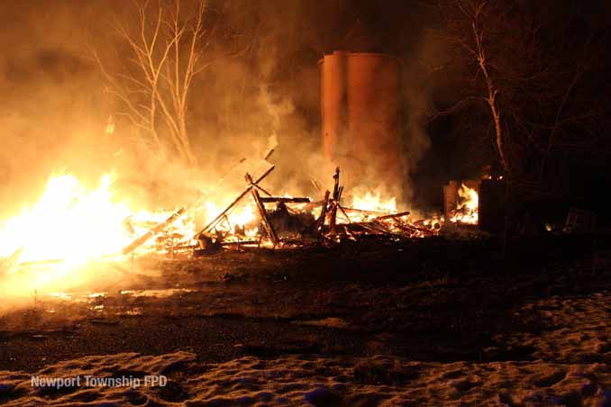 Fire burns with most of burning barn collapsed on property on Kazmer Road in Newport Township (SOURCE: Newport Township Fire Protection District)