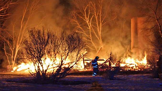 Firefighter walks across property in front of burning barn on Kazmer Road in Newport Township (SOURCE: Newport Township Fire Protection District) Firefighter walks across property in front of burning barn on Kazmer Road in Newport Township (SOURCE: Newport Township Fire Protection District)