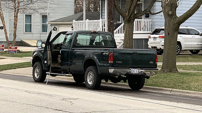 Power line down on pickup truck on Dunton Avenue between Euclid Avenue and Hawthorne Street in Arlington Heights
