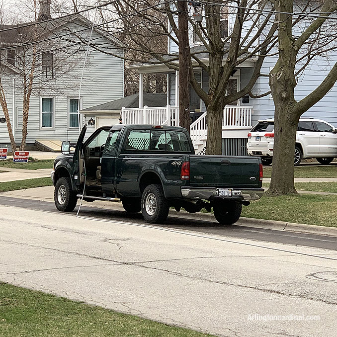 Power line down on pickup truck on Dunton Avenue between Euclid Avenue and Hawthorne Street in Arlington Heights