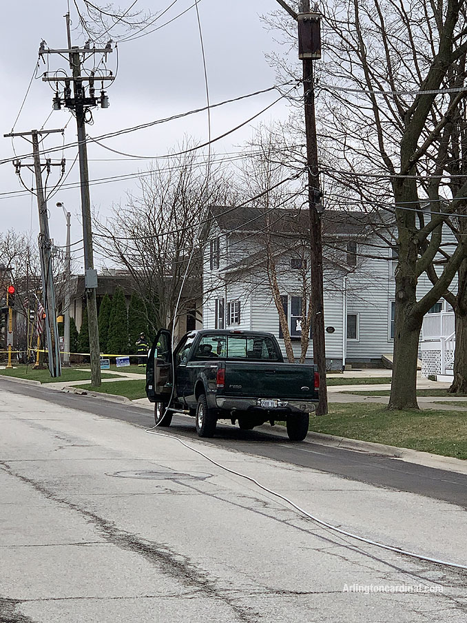 Power line down on pickup truck on Dunton Avenue between Euclid Avenue and Hawthorne Street in Arlington Heights