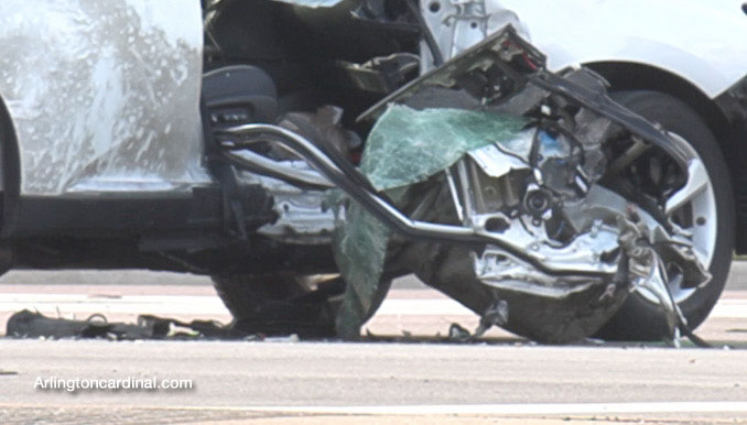 Part of the frame of the motorcycle against the passenger side of the Lexus SUV at Golf Road and National Parkway in Schaumburg.