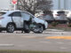 Part of the frame of the motorcycle against the passenger side of the Lexus SUV at Golf Road and National Parkway in Schaumburg