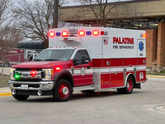 Paramedic crew from Palatine Ambulance 84 transporting a patient found on the roof at William Fremd High School to a local hospital