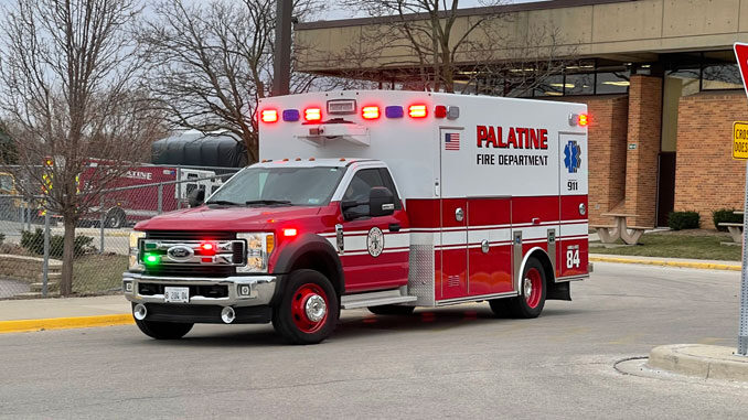 Paramedic crew from Palatine Ambulance 84 transporting a patient found on the roof at William Fremd High School to a local hospital