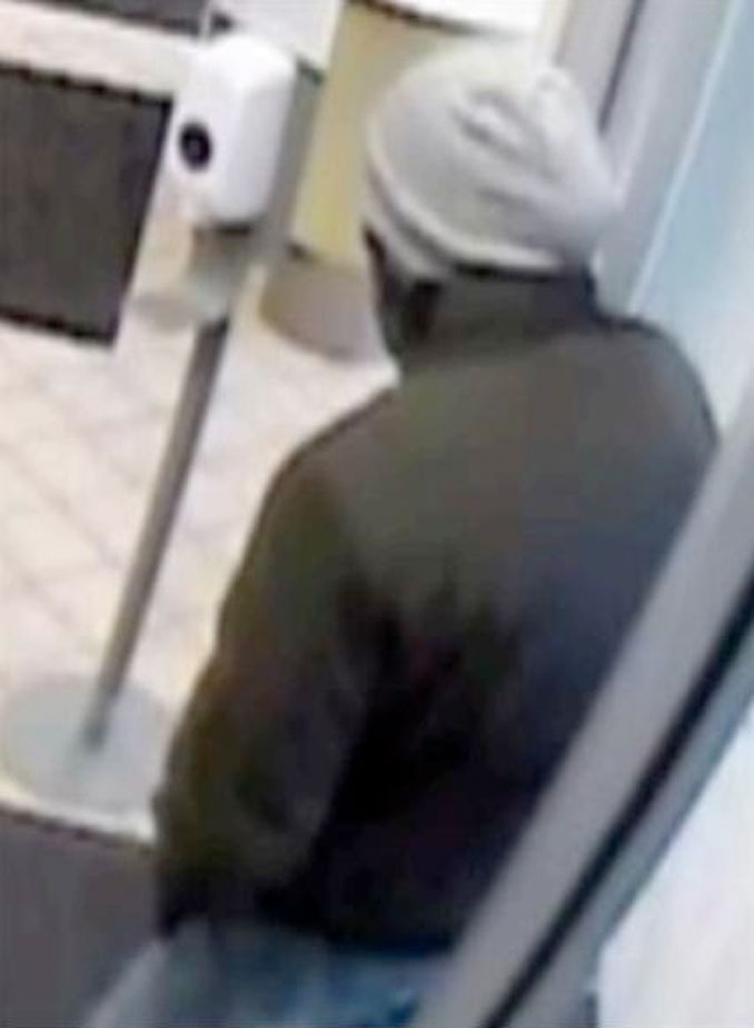 Bank robber at BMO Harris Bank, 9101 Cermak Avenue in Riverside (surveillance video still)