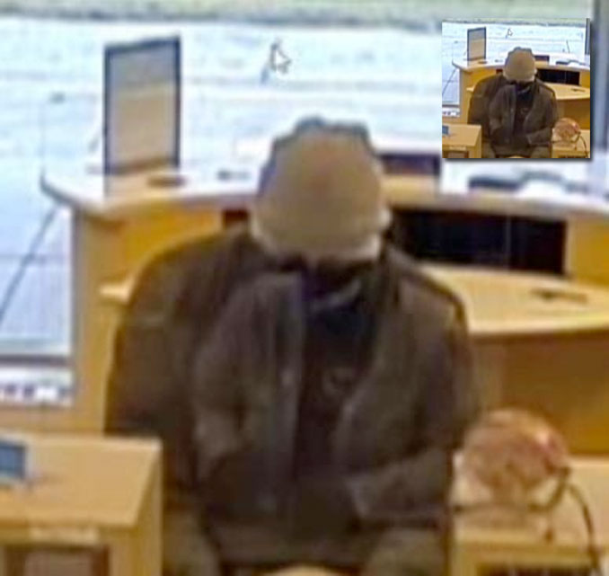 Bank robber at BMO Harris Bank, 9101 Cermak Avenue in Riverside (surveillance video still)