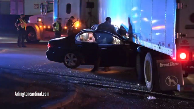 Car crash under semi-trailer on Higgins Road in Elk Grove Village on Wednesday, April 7, 2021