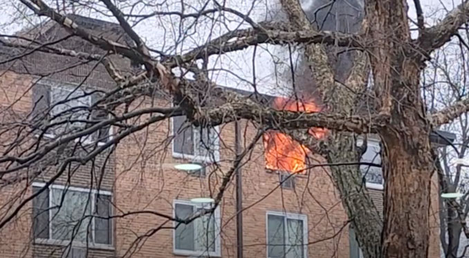 Flames from window of Mallard Cove condo unit at Extra-Alarm Fire on Saturday morning, December 23, 2023 (obtained photo)