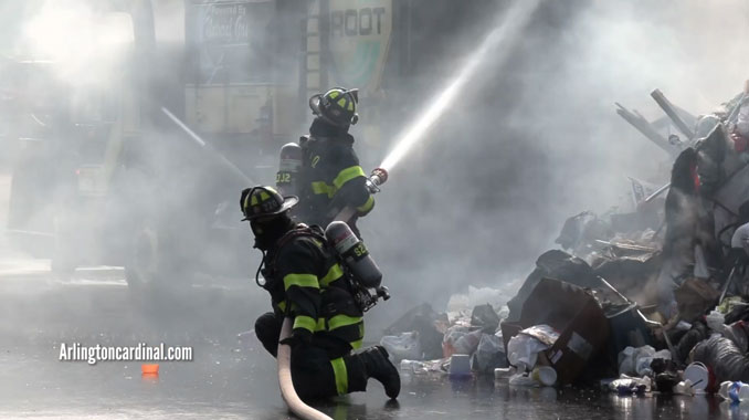 Garbage truck fire at Saint James Church in Arlington Heights on Friday, April 23, 2021