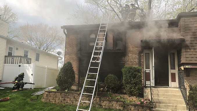 House fire with a ground ladder at Side A on Gatewood Lane in Woodridge, Wednesday, April 21, 2021 (SOURCE: Lisle-Woodridge Fire District)