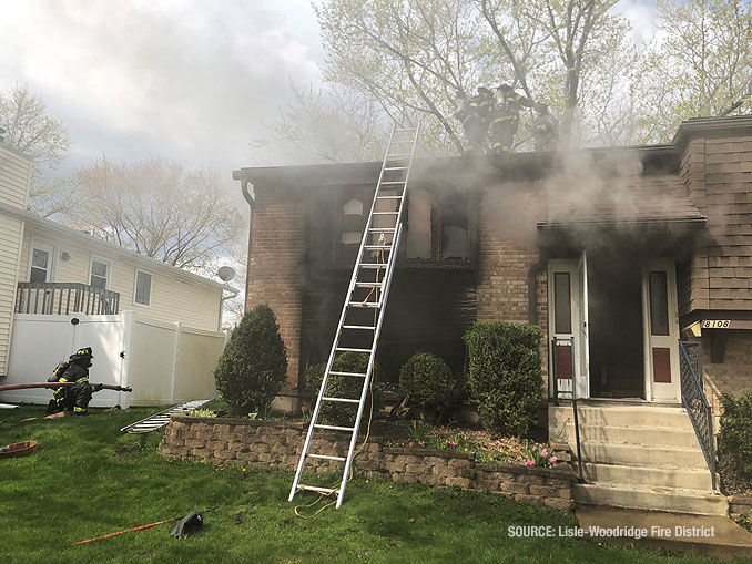 House fire with a ground ladder at Side A on Gatewood Lane in Woodridge, Wednesday, April 21, 2021 (SOURCE: Lisle-Woodridge Fire District)