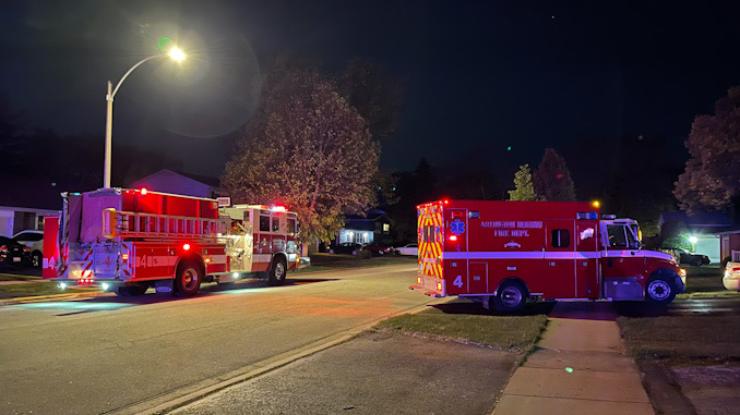 Arlington Heights Fire Department in front of house where a fire pit ignited a patio deck