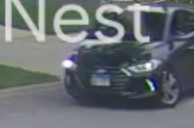 Suspect's black Hyundai Accent Limited, while backing into neighbor's driveway (Security Image)
