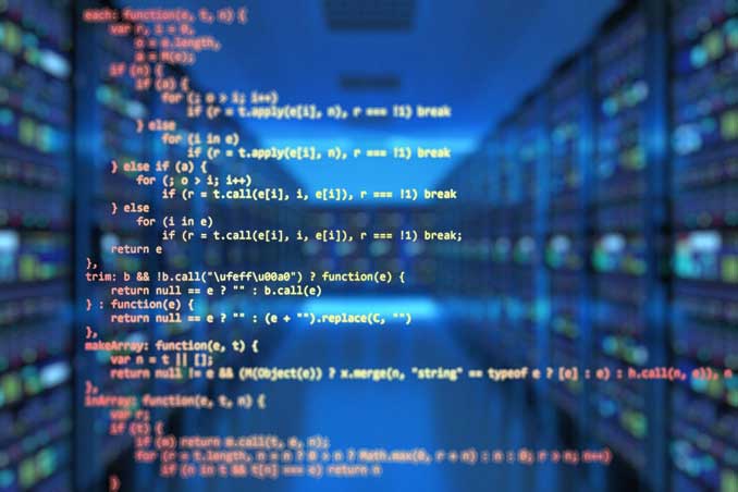 Source code superimposed over a data room or server room at a business.