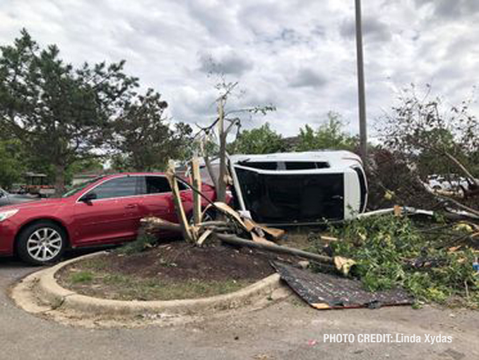 Vehicle flipped with damage from a tornado at The Estates of Thornberry Woods on Gladstone Drive just south of 75th Street near the border of Naperville and Woodridge