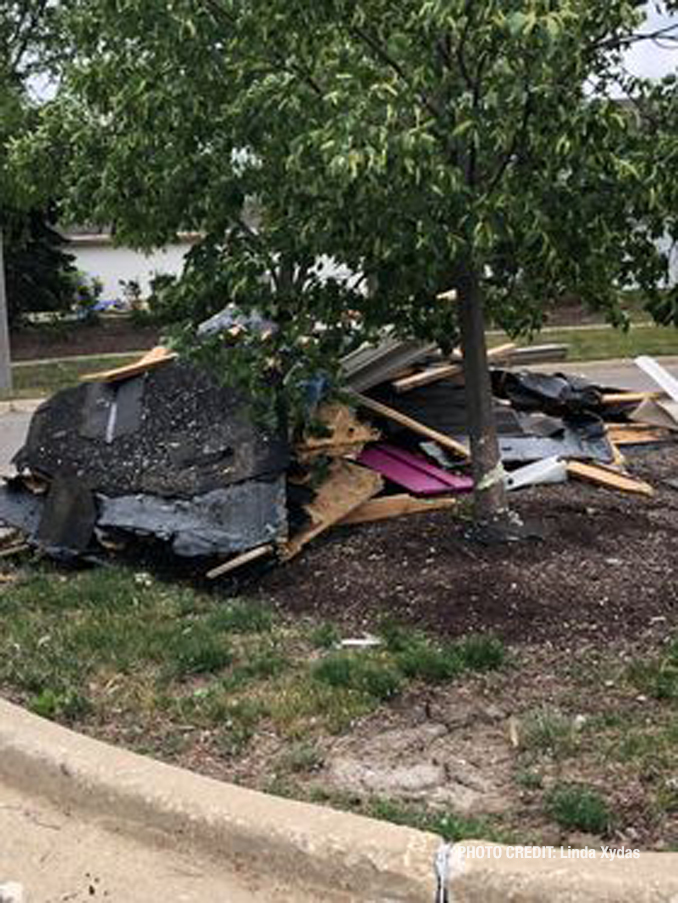 Roof debris on the ground at The Estates of Thornberry Woods on Gladstone Drive just south of 75th Street near the border of Naperville and Woodridge.