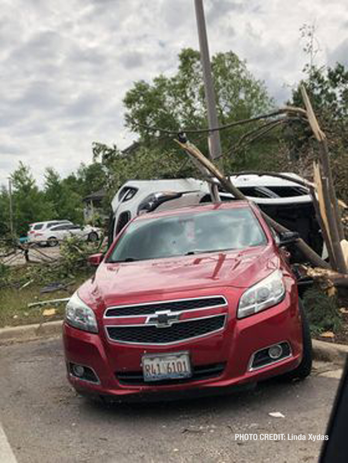 Vehicle flipped with damage from a tornado at The Estates of Thornberry Woods on Gladstone Drive just south of 75th Street near the border of Naperville and Woodridge