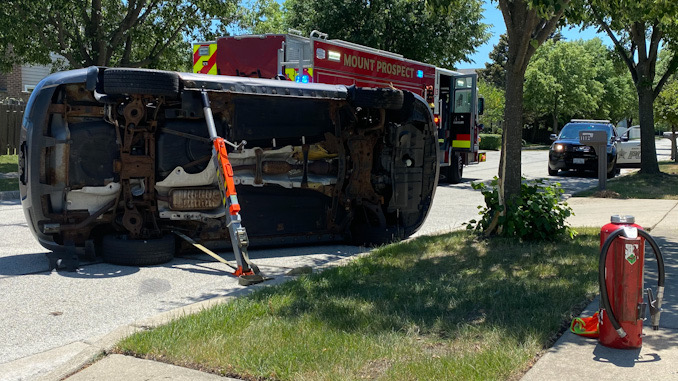 Car vs tree rollover crash on Heritage Drive Mount Prospect