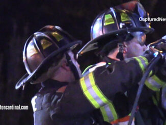 Extrication on the driver's side of a Chevrolet work van with a strut stabilizing the van