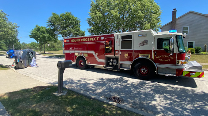 Car vs tree rollover crash on Heritage Drive Mount Prospect.