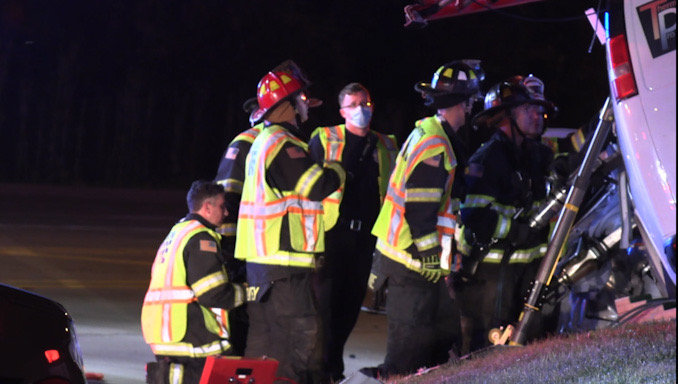 Extrication on the driver's side of a Chevrolet work van with a strut stabilizing the van while another crew was working on the passenger side