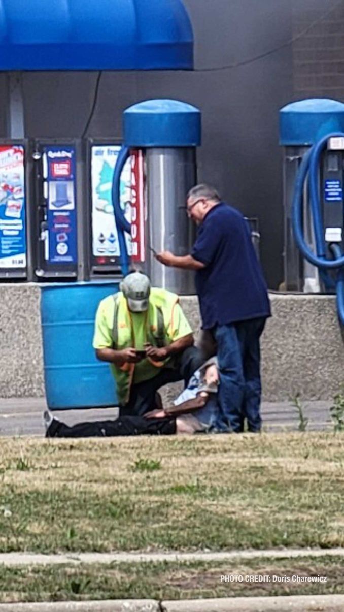 Good Samaritans help a man when his car was burning at a America's Best Car Wash in Mount Prospect on South Elmhurst Road in Mount Prospect (PHOTO CREDIT: Doris Charewicz)