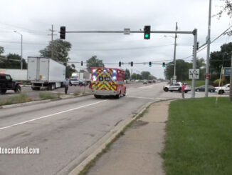 Wheeling Fire Department Ambulance 23 transporting Lexus driver to Glenbrook Hospital, passing crashed semi-trailer truck at Palatine Road and Wheeling Road