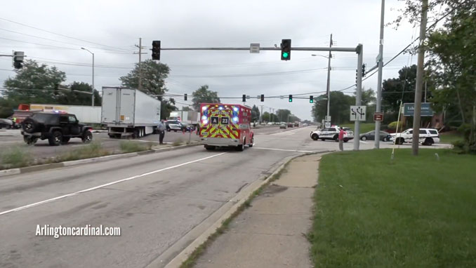 Wheeling Fire Department Ambulance 23 transporting Lexus driver to Glenbrook Hospital, passing crashed semi-trailer truck at Palatine Road and Wheeling Road