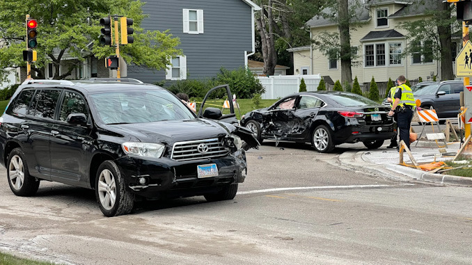 Toyota SUV (foreground) with left-front damage and Hyundai sedan at Arlington Heights Road and Olive Street on Friday, July 30, 2021