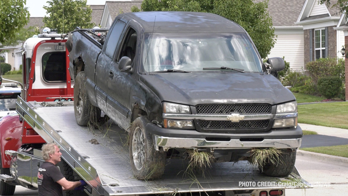 Offender's Chevrolet Silverado on a flatbed tow truck after he was captured in the Grand Dominion by Del Webb community following a pursuit that started in Wauconda (SOURCE: Craig/CapturedNews)